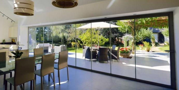 Frameless Folding Doors are a type of door system that consists of large, glass panels without the traditional visible frame, providing a sleek and minimalist appearance. These doors are designed to fold and stack to one side, allowing for an open, unobstructed space between rooms or between indoor and outdoor areas. The frameless design enhances the overall aesthetic by offering a clear view and maximizing natural light. The folding mechanism makes them highly flexible, providing the option to open up wide expanses or keep sections of the door closed as needed, making them ideal for spaces where both functionality and modern design are desired.